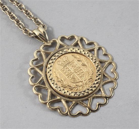 A 2000 gold half sovereign in pendant mount, on a 9ct gold chain.